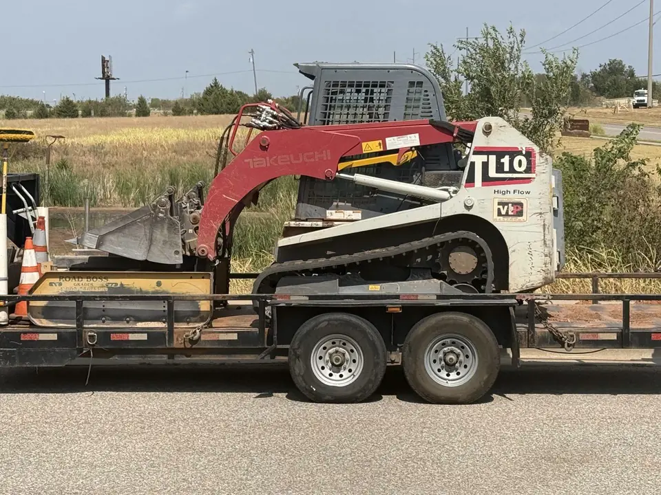 Takeuchi TL10 track loader loaded on a trailer