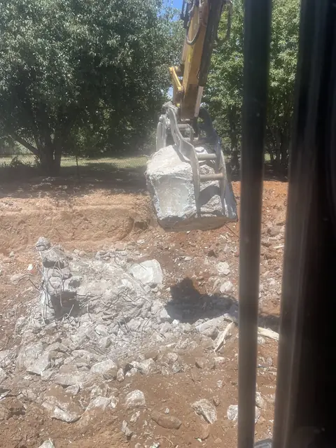 Concrete broken up and piled, seen from the cab