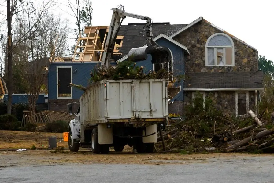 Storm debris loaded into a dump truck